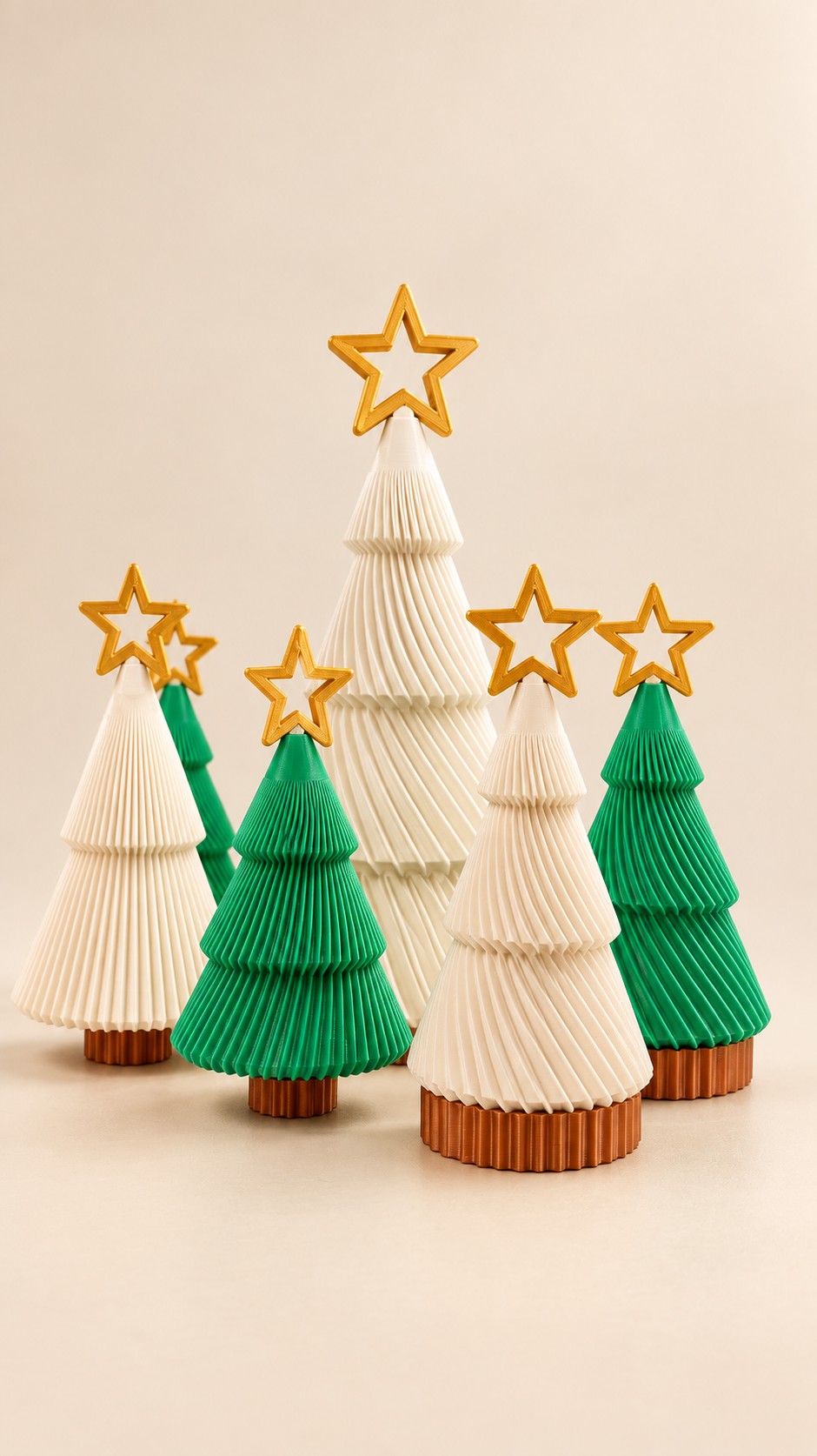 Green and ivory ribbed Christmas trees topped with gold outline stars.
